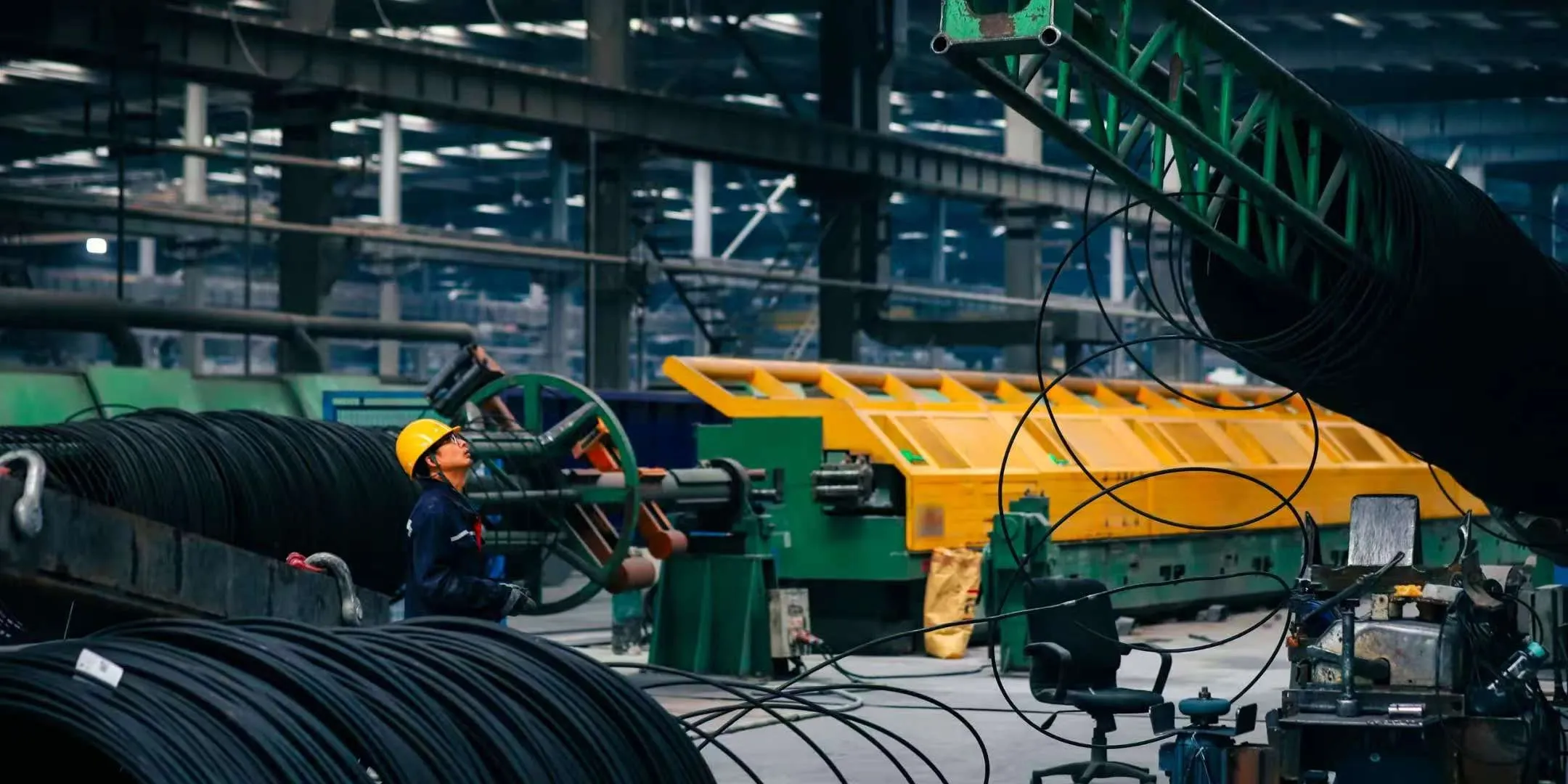 Wire reels and processing equipment in a production workshop