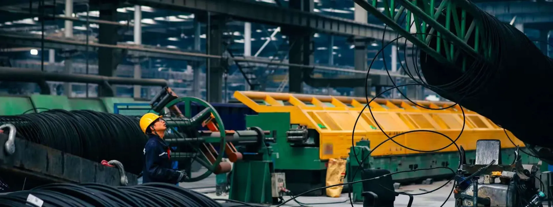 Wire coils and handling equipment in a production workshop